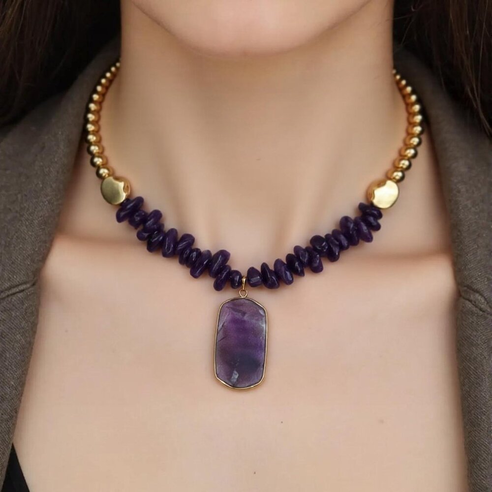 Focus on Purple. Purple rotate beads finished in gold with Purple pendant